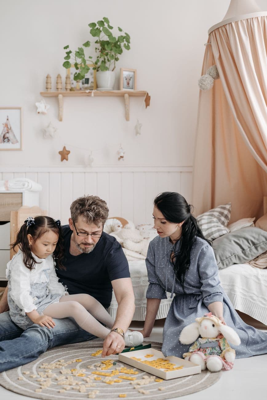 Family enjoying a board game reward together at home